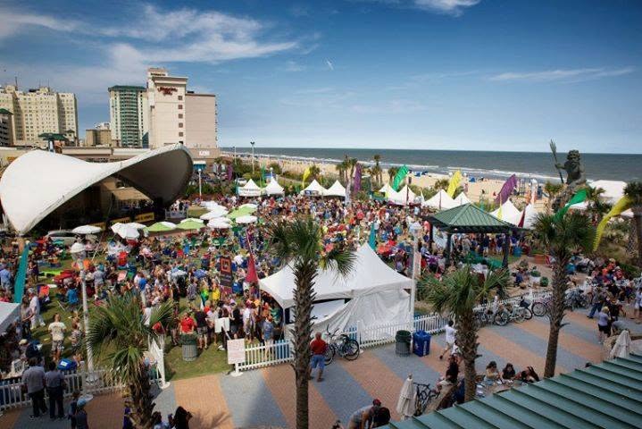 Live concert crowd at a Virginia Beach Boardwalk park stage